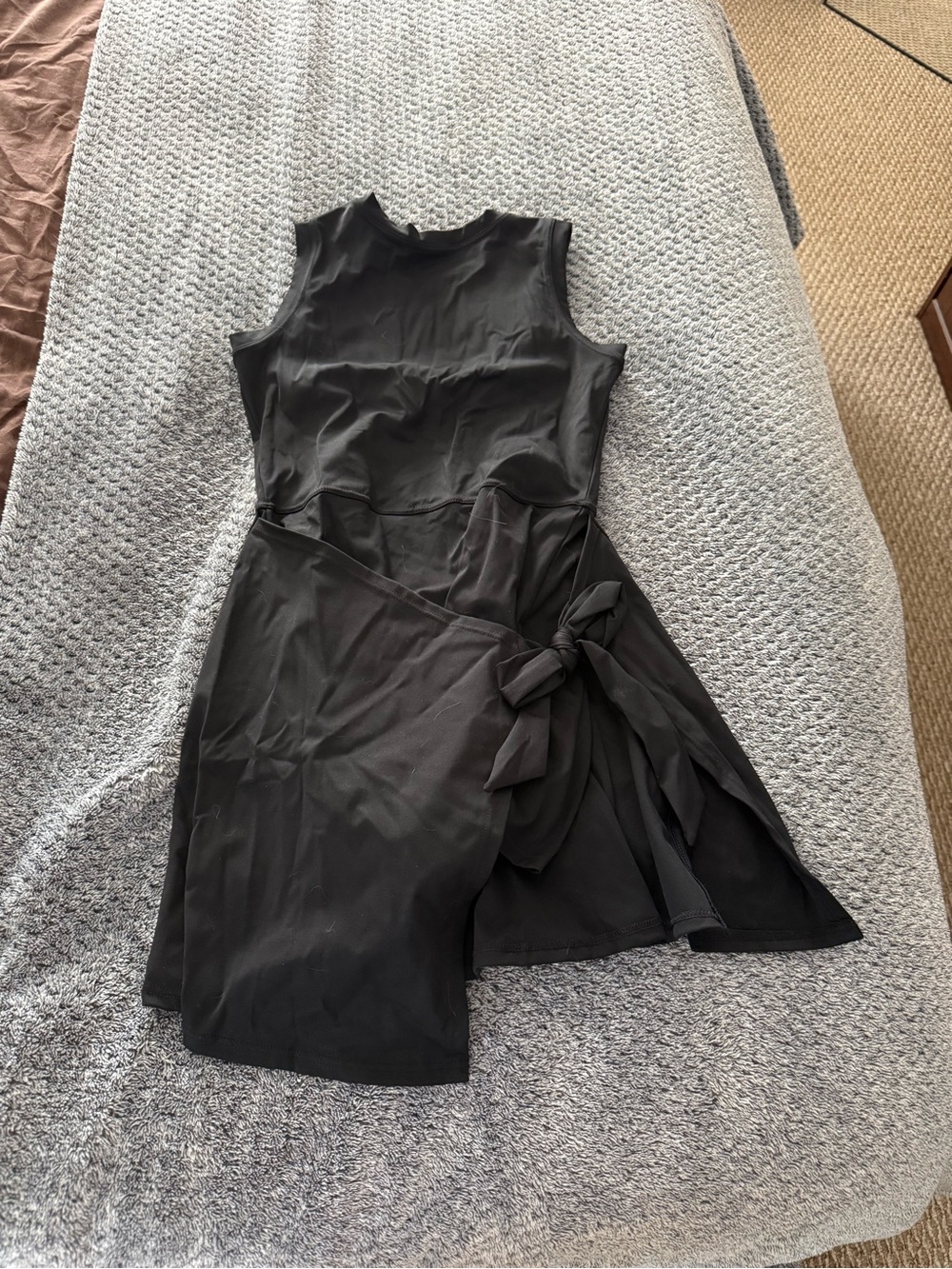 Sleek Black Sleeveless Mini Dress with Side Tie